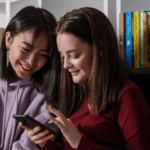 Two girls looking at phone
