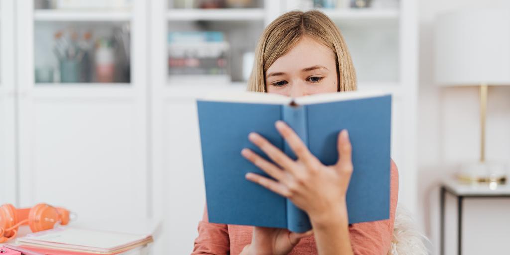 14-year-old girl reading book